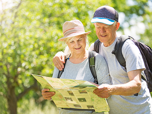 Active adult couple out for a local hike>